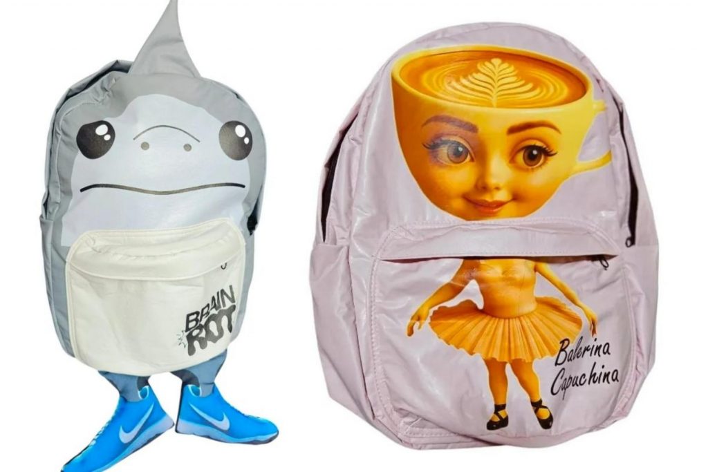 Dos mochilas con diseños poco comunes de "Balerina Capuchina" y un tiburón.