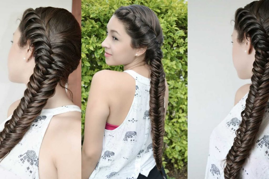 Una mujer mostrando una trenza de espiga o "fishtail braid". La nota ofrece este peinado como una opción moderna y elegante para la Noche Mexicana.